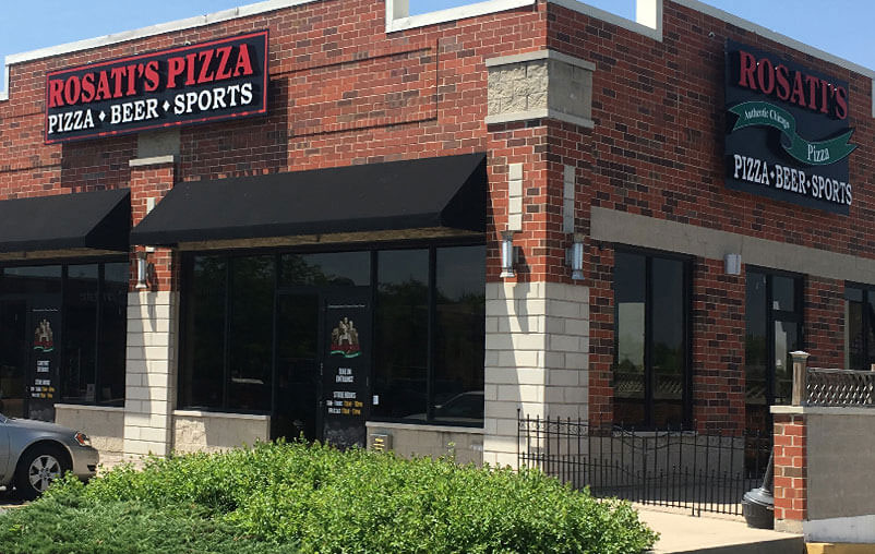Exterior picture of a Rosati's Pizza sports pub with brick walls and black awnings